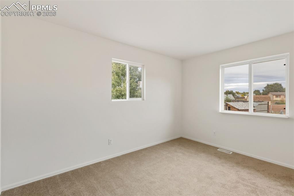 9430 Bar B Road Fountain, CO 80817 - Photo 32 of 43 an empty room with windows