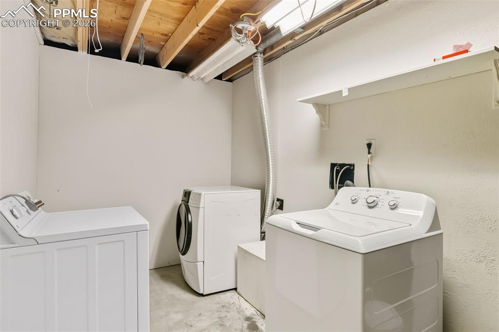 9430 Bar B Road Fountain, CO 80817 - Photo 39 of 43 a bathroom with a sink a toilet and mirror