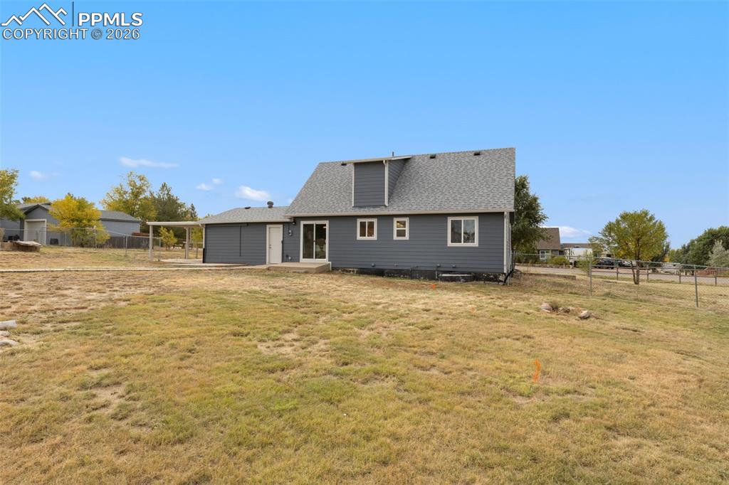 9430 Bar B Road Fountain, CO 80817 - Photo 41 of 43 a view of a house with a yard