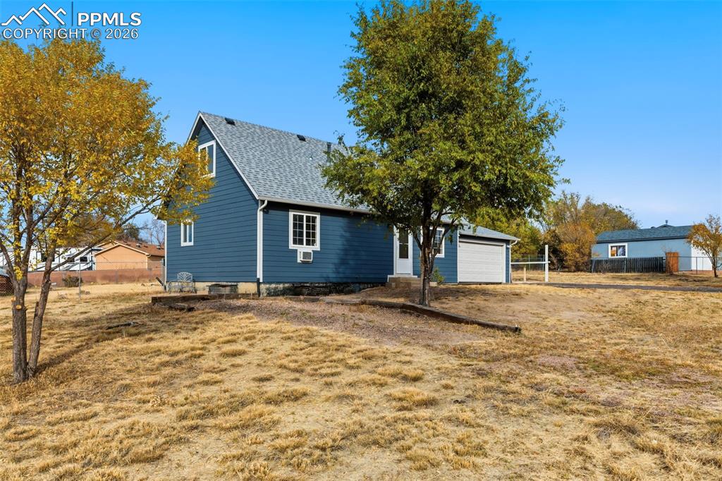 9430 Bar B Road Fountain, CO 80817 - Photo 8 of 43 a view of a house with a yard