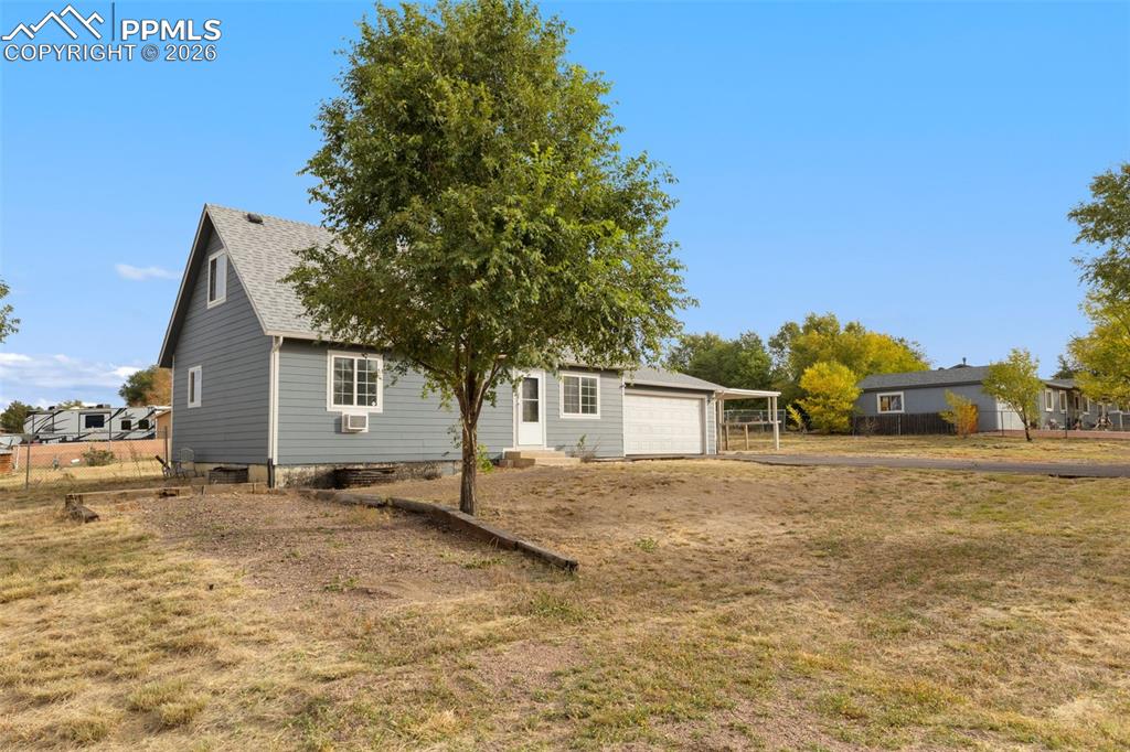 9430 Bar B Road Fountain, CO 80817 - Photo 9 of 43 a view of a house with a yard