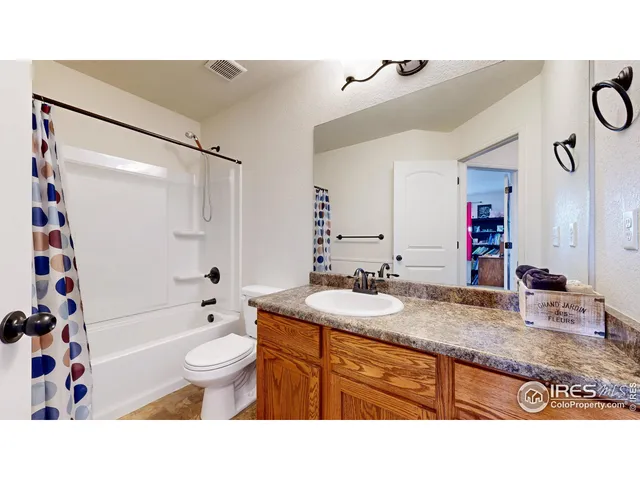 a bathroom with a sink toilet tub and shower
