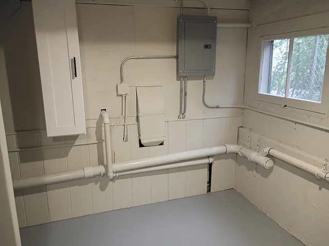 a bathroom with a bathtub and a shower