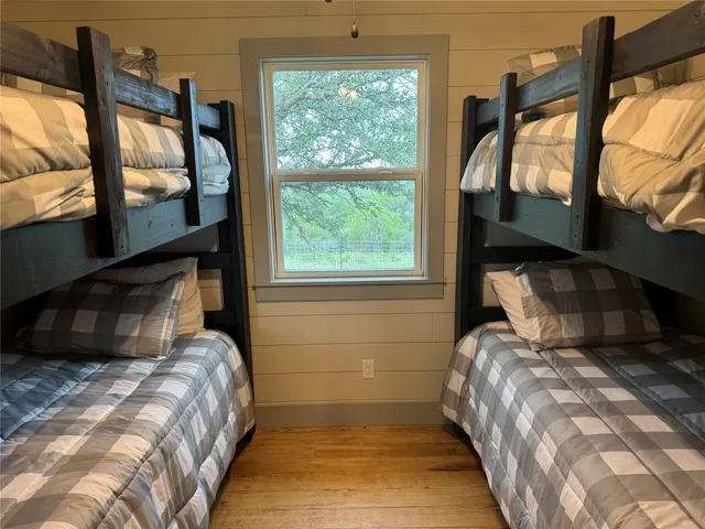 a view of a field of grass and trees