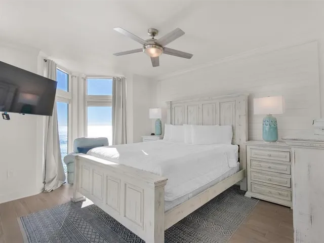 a bed room with a bed and a television