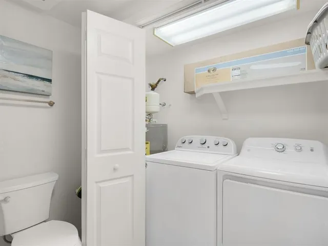 a view of bathroom with a washer and dryer