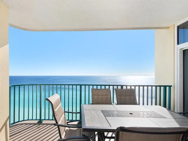 a view of a chair and table on the deck