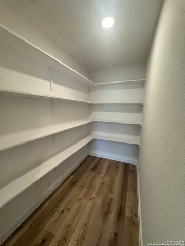 a storage room with wooden floor