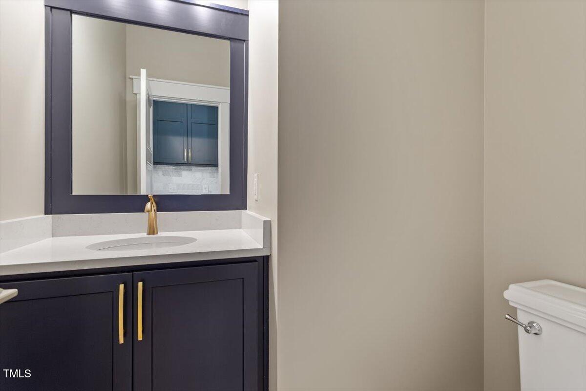 3934 Old Chapel Hill Road Durham, NC 27707 - Photo 17 of 47 a bathroom with a sink and a mirror
