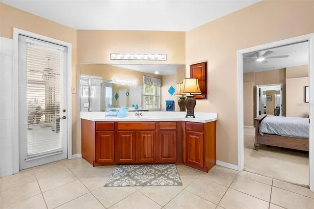a large bathroom with a sink a mirror and a vanity