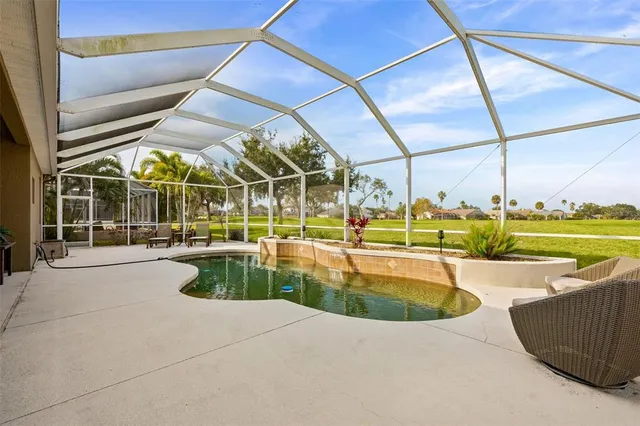 a view of a swimming pool with a patio