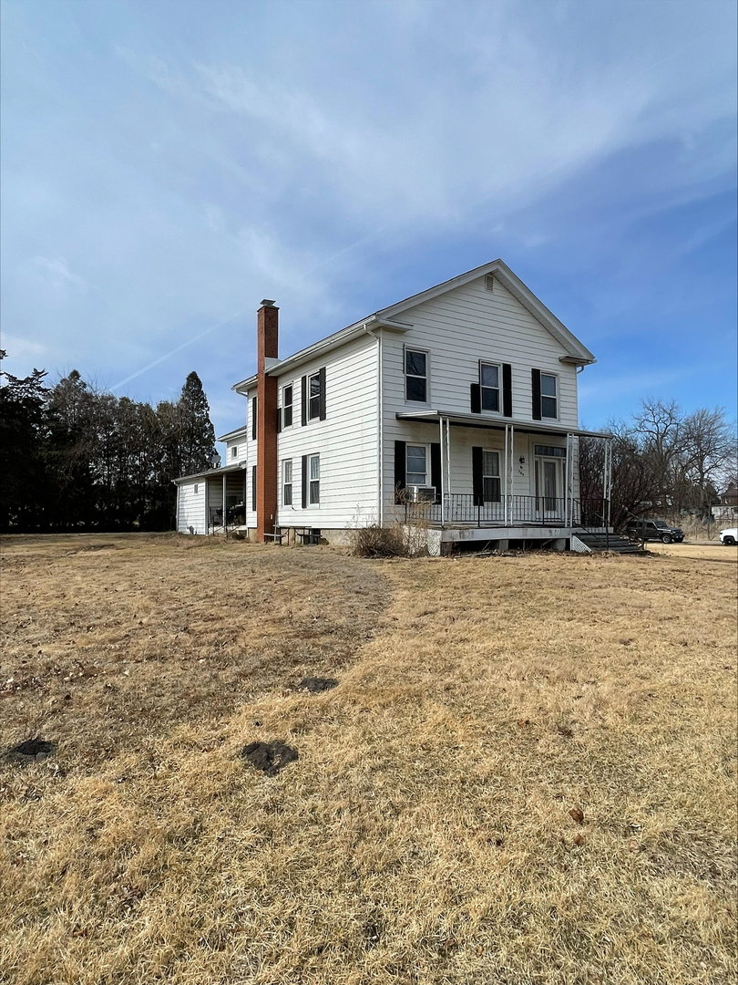 106 South East Street Dover, IL 61323 - Photo 2 of 9 a front view of a house with a yard