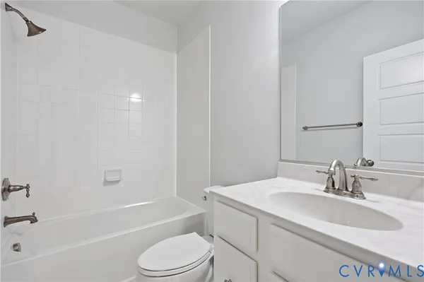 a bathroom with a sink toilet and bathtub