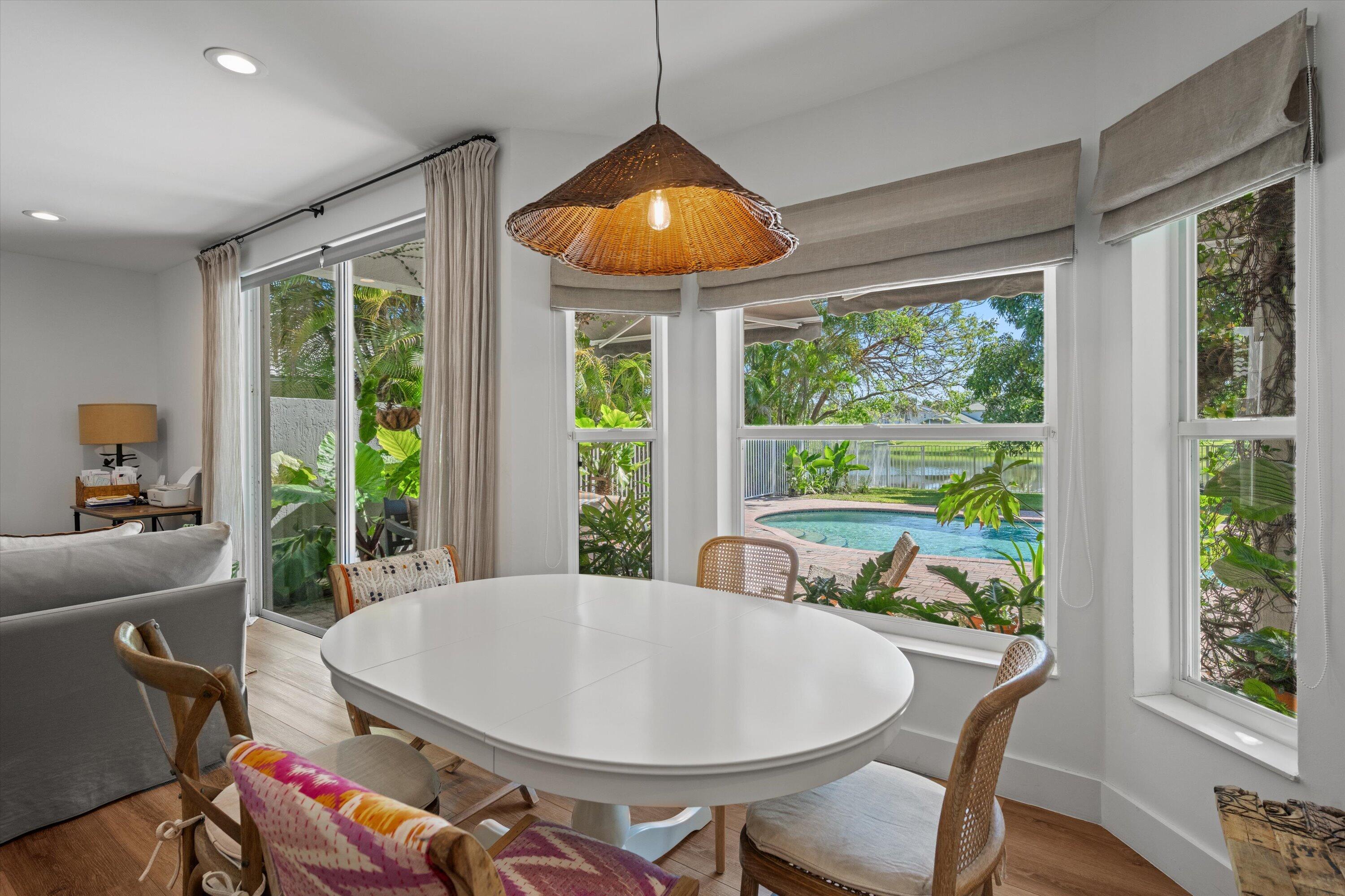 4138 Bluff Harbor Way Wellington, FL 33449 - Photo 14 of 48 a view of a dining room with furniture window and outside view