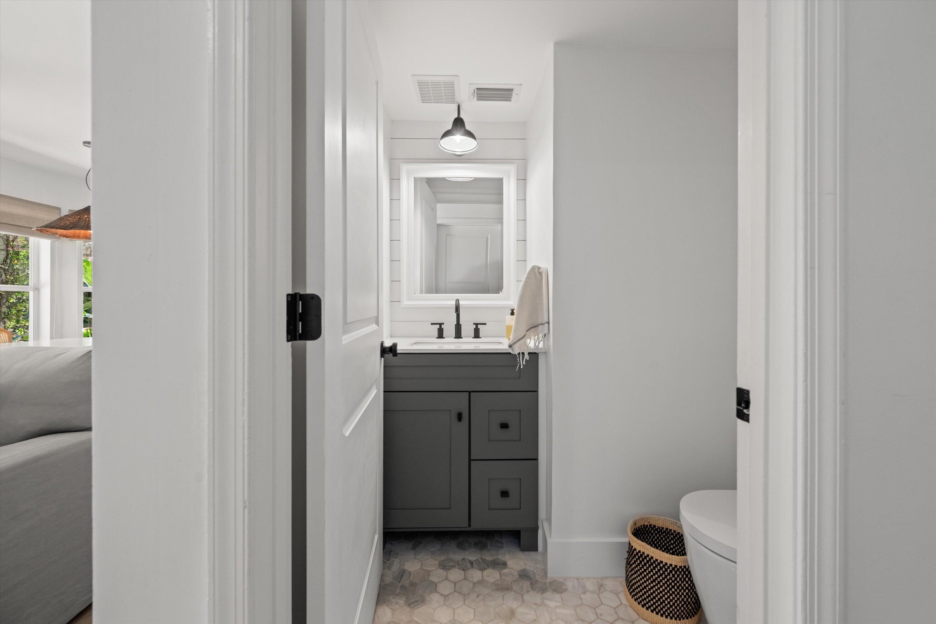 4138 Bluff Harbor Way Wellington, FL 33449 - Photo 21 of 48 a bathroom with a sink toilet and mirror