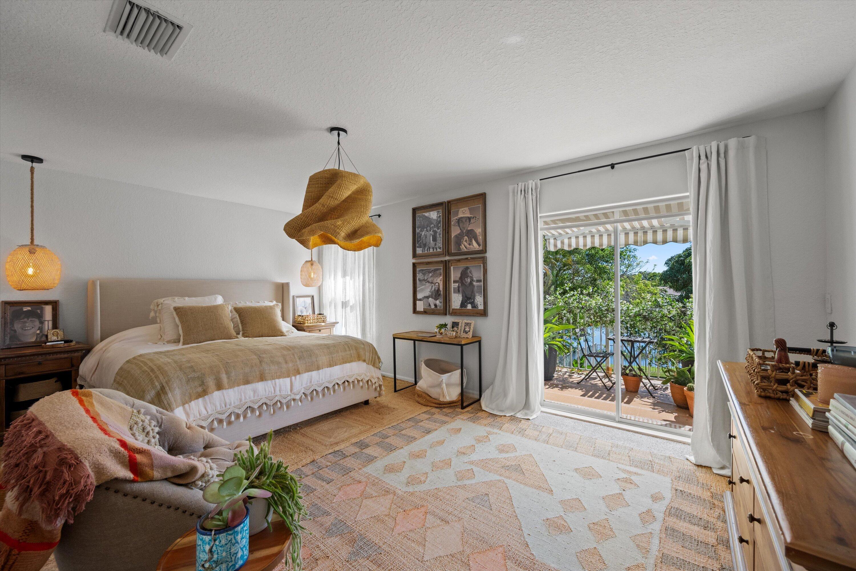 4138 Bluff Harbor Way Wellington, FL 33449 - Photo 23 of 48 a spacious bedroom with a bed and a window