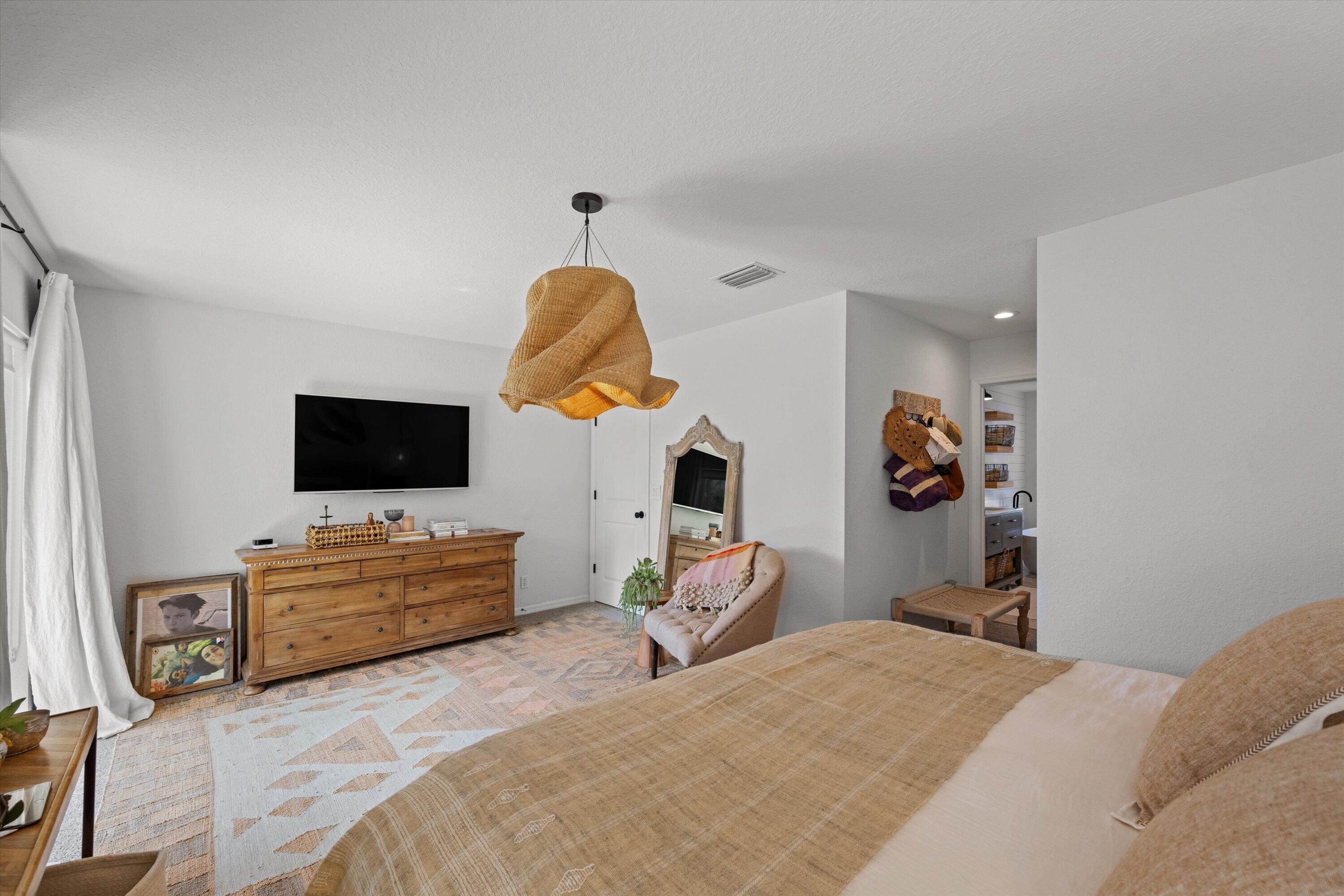 4138 Bluff Harbor Way Wellington, FL 33449 - Photo 24 of 48 a bedroom with furniture and a flat screen tv