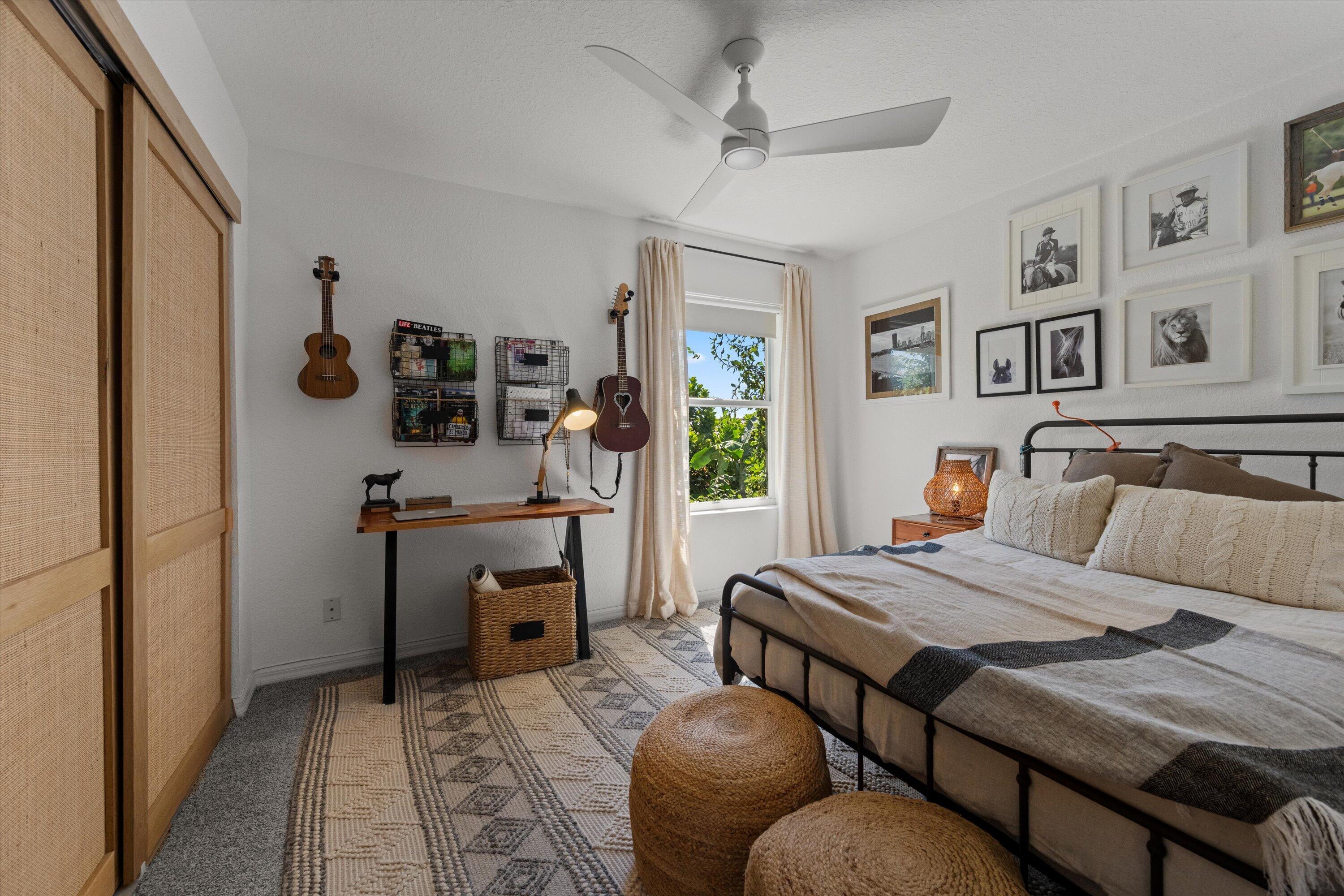 4138 Bluff Harbor Way Wellington, FL 33449 - Photo 27 of 48 a bedroom with furniture and a wooden floor