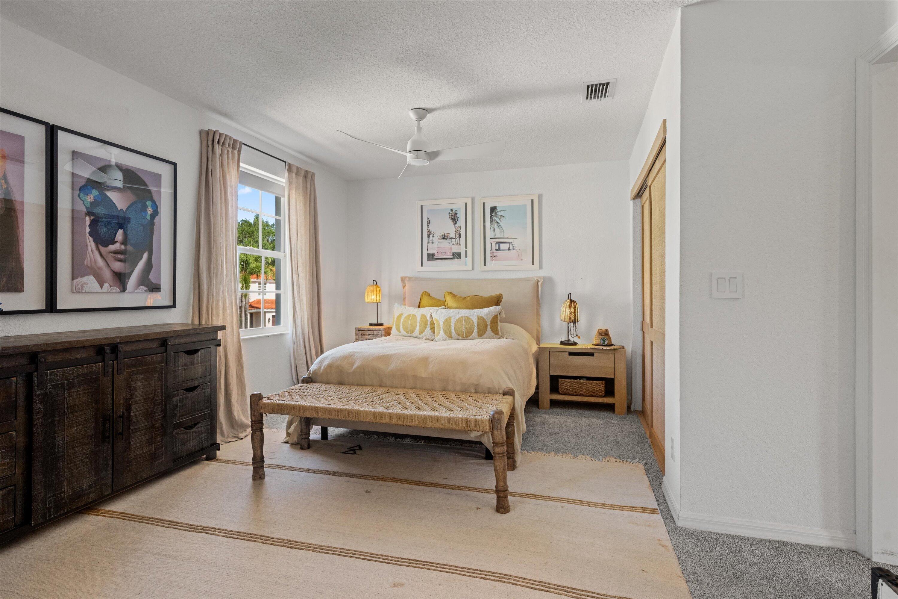 4138 Bluff Harbor Way Wellington, FL 33449 - Photo 30 of 48 a bedroom with a bed and window