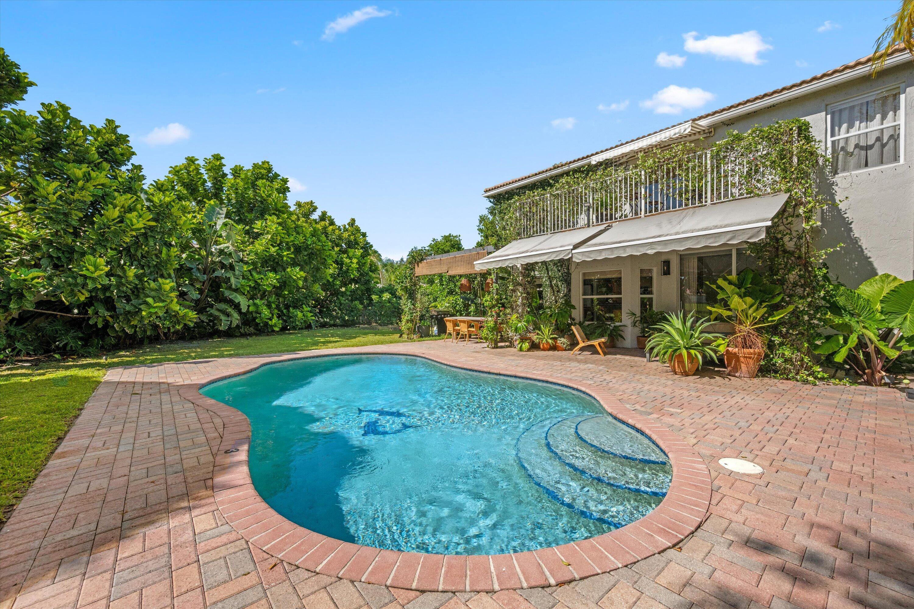 4138 Bluff Harbor Way Wellington, FL 33449 - Photo 36 of 48 a view of a swimming pool with a patio
