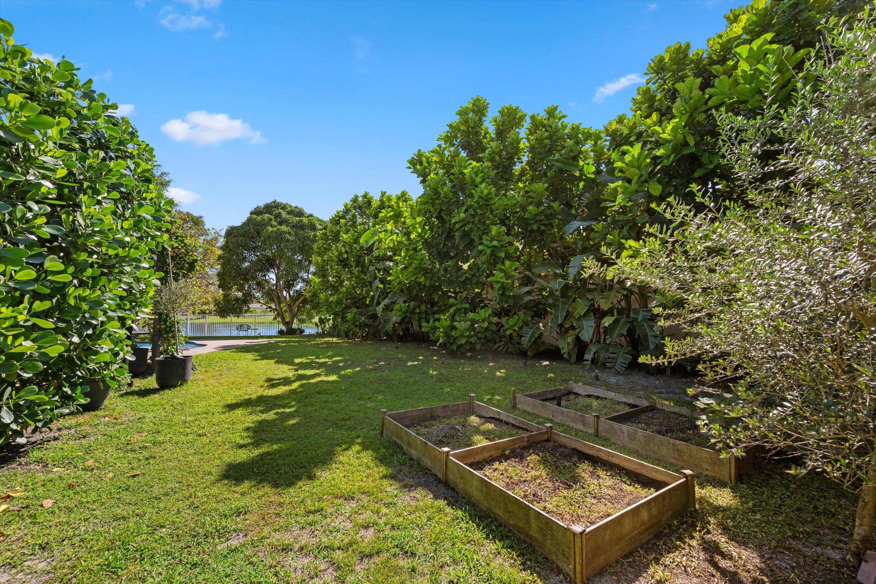 4138 Bluff Harbor Way Wellington, FL 33449 - Photo 40 of 48 a view of a small park with large trees