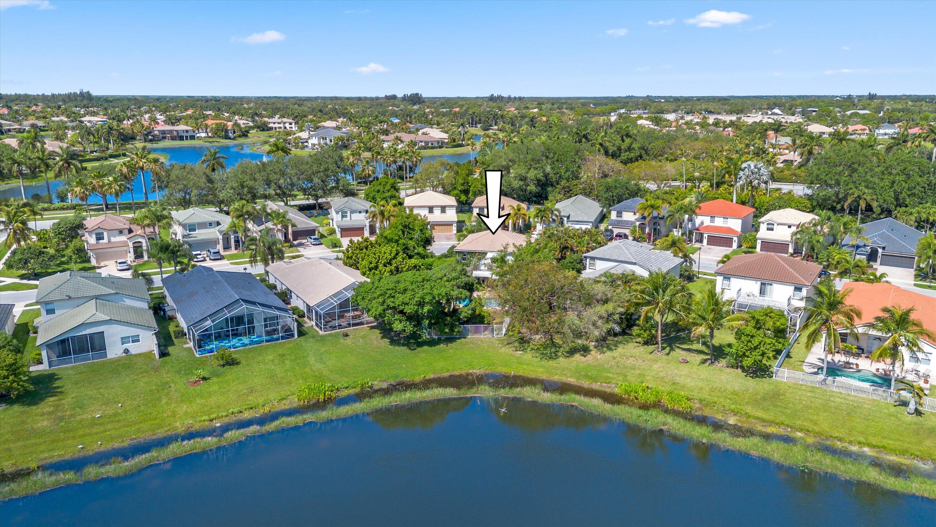 4138 Bluff Harbor Way Wellington, FL 33449 - Photo 42 of 48 an aerial view of residential houses with outdoor space and ocean view