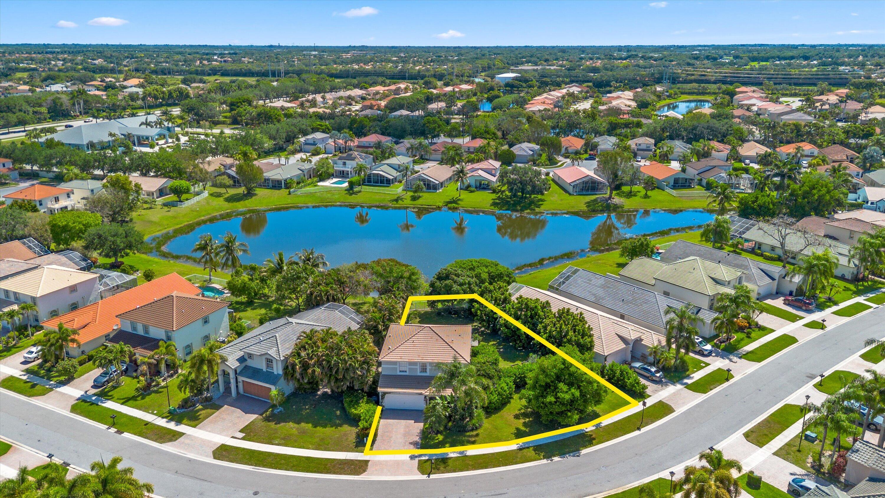 4138 Bluff Harbor Way Wellington, FL 33449 - Photo 47 of 48 an aerial view of residential houses with outdoor space and swimming pool