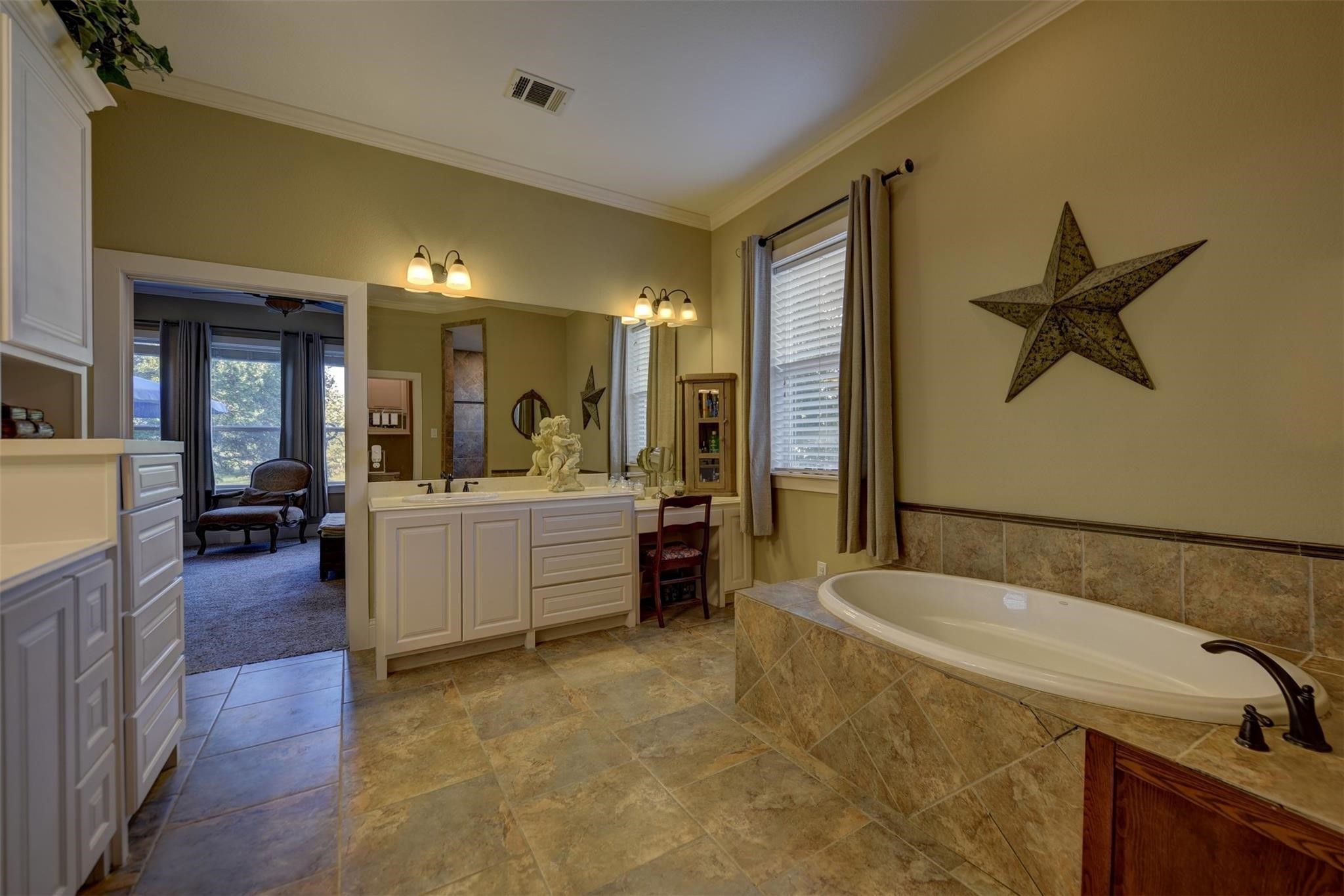 8456 Schuster Road Ledbetter, TX 78946 - Photo 23 of 49 a bathroom with a tub a sink a mirror and a shower