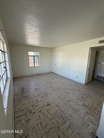 a view of a room with appliances and cabinets
