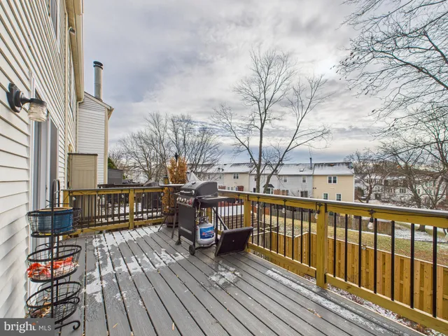 a view of a balcony with wooden floor