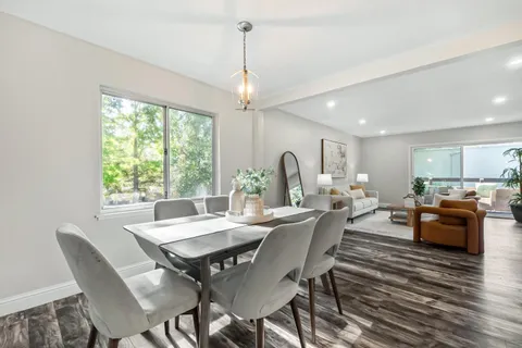 a view of a dining room with furniture window and outside view