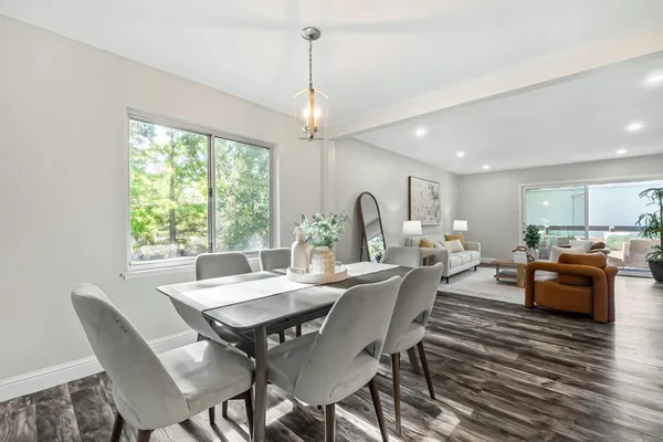 a view of a dining room with furniture window and outside view