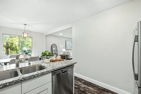 a kitchen with a sink and a window