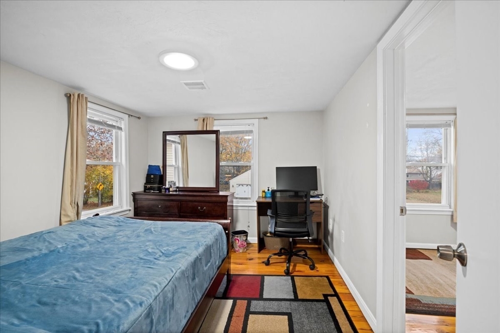 65 Edgewater Avenue Shrewsbury, MA 01545 - Photo 12 of 35 a room with a bed and a window