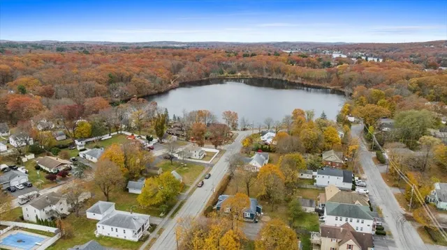 a view of a house with swimming pool and sitting area