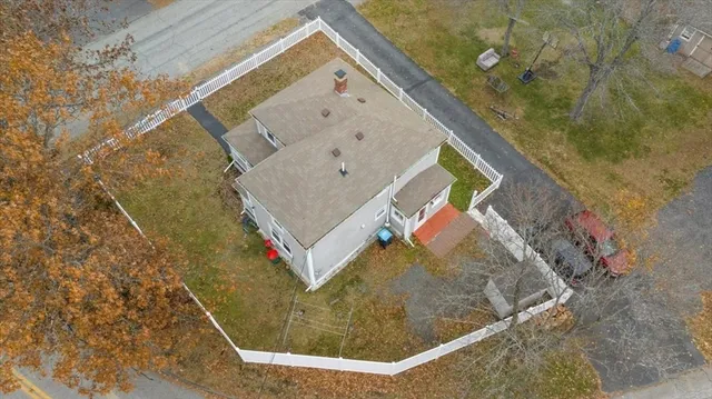 an aerial view of a house with a lake view