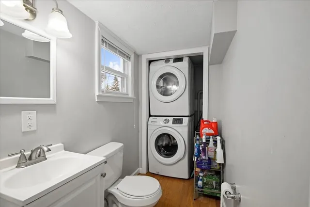 a bathroom with a washing machine and dryer