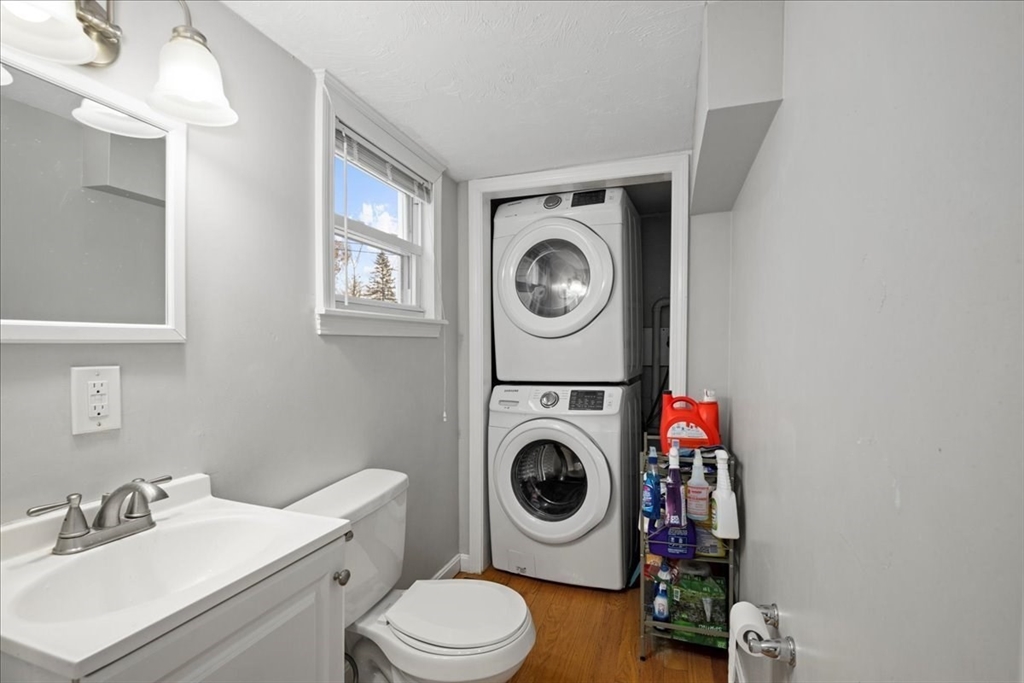 65 Edgewater Avenue Shrewsbury, MA 01545 - Photo 7 of 35 a bathroom with a washing machine and dryer