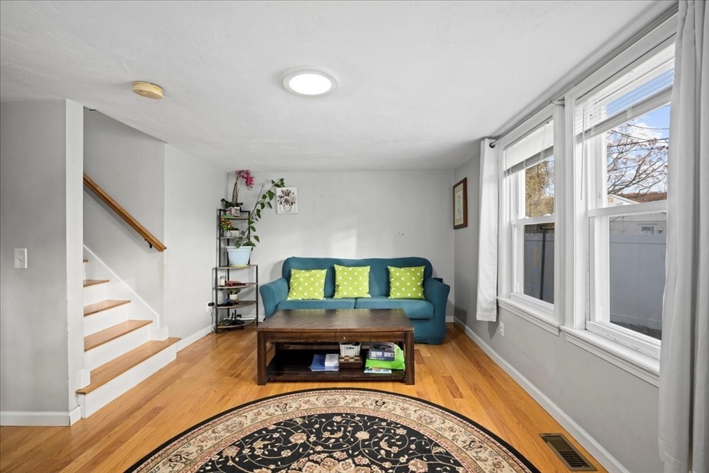 65 Edgewater Avenue Shrewsbury, MA 01545 - Photo 9 of 35 a living room with furniture and a wooden floor