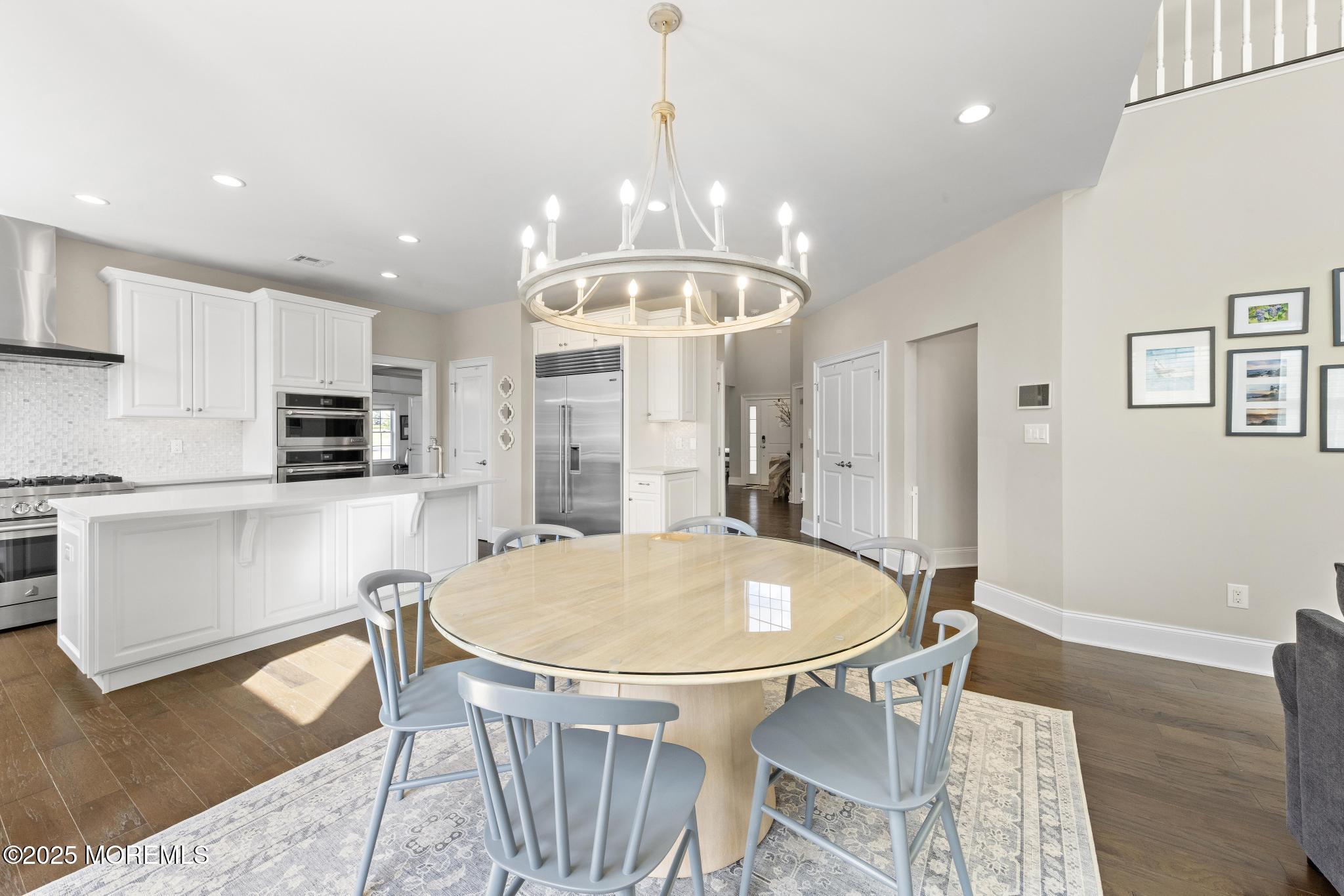 45 Windermere Road Lincroft, NJ 07738 - Photo 13 of 68 a view of a dining room with furniture and wooden floor