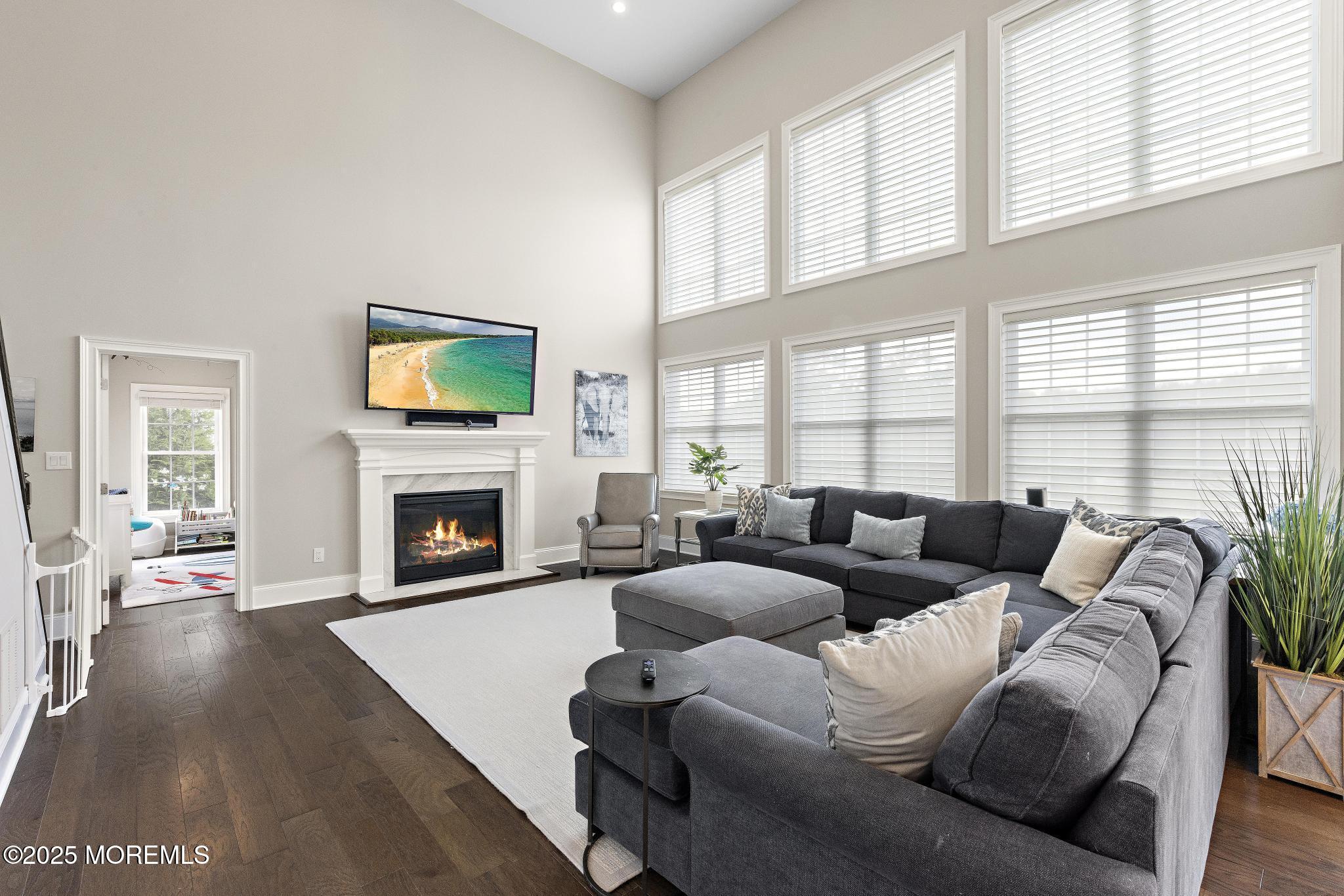 45 Windermere Road Lincroft, NJ 07738 - Photo 15 of 68 a living room with furniture fireplace and a large window