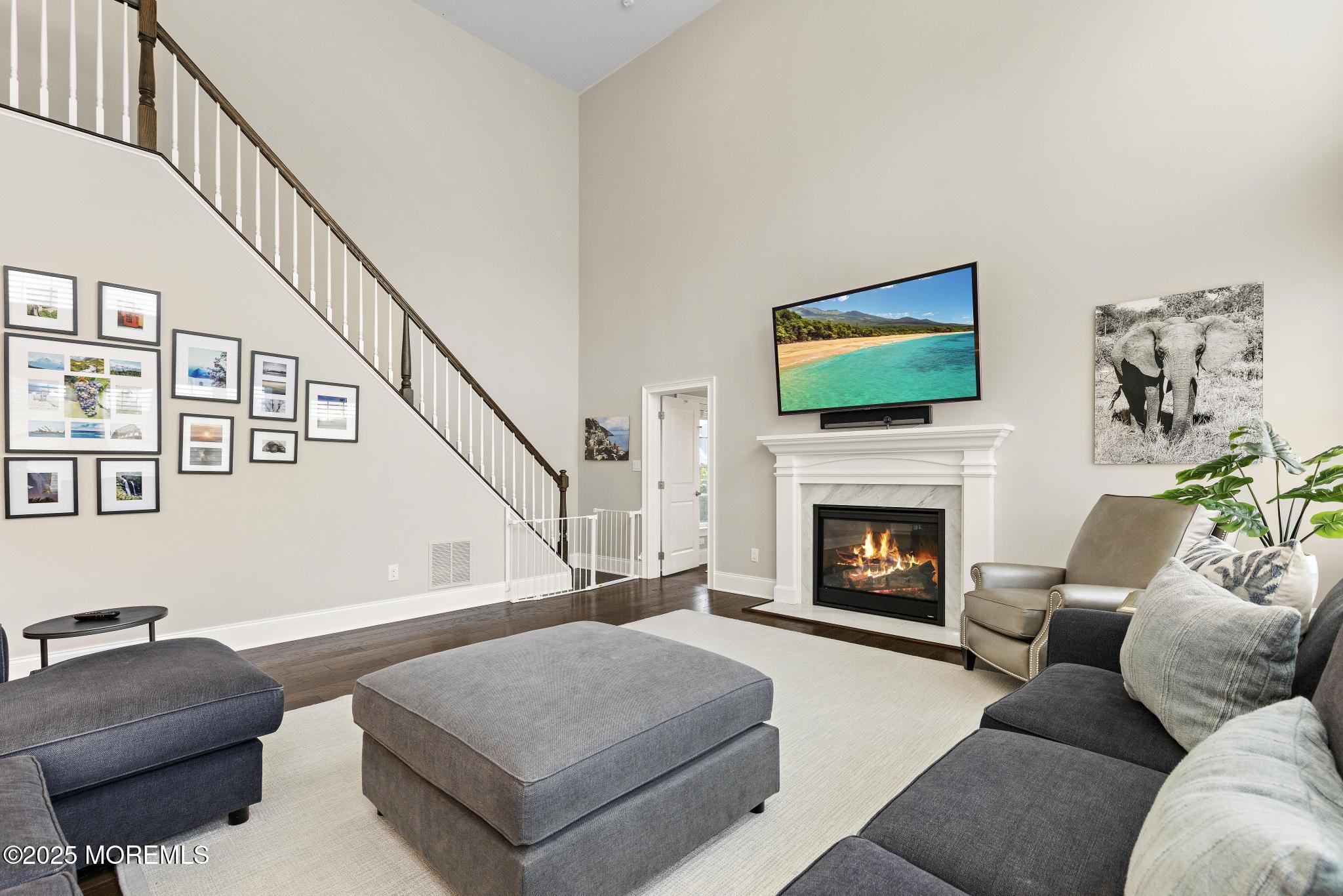 45 Windermere Road Lincroft, NJ 07738 - Photo 16 of 68 a living room with furniture and a fireplace