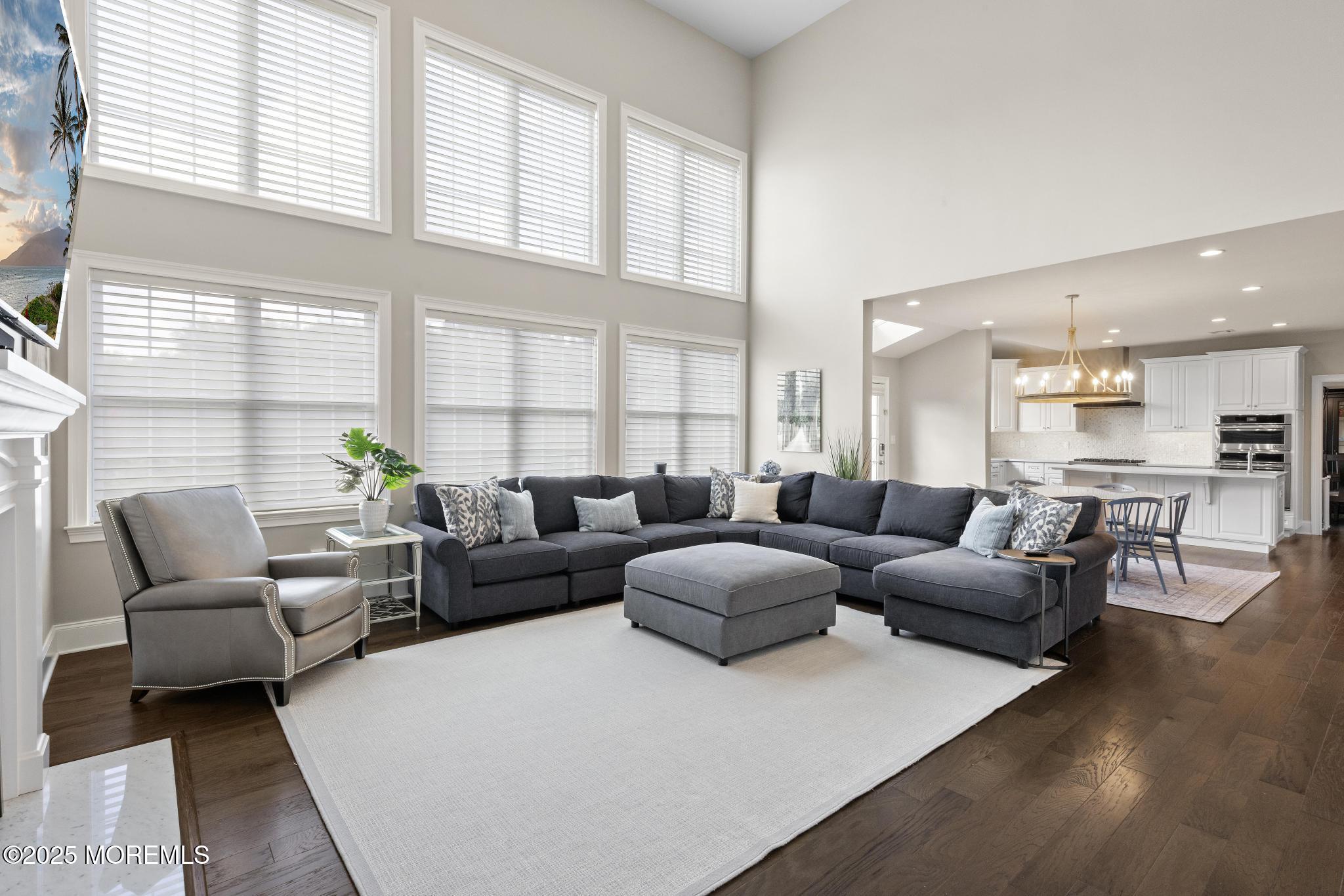 45 Windermere Road Lincroft, NJ 07738 - Photo 17 of 68 a living room with furniture and a large window
