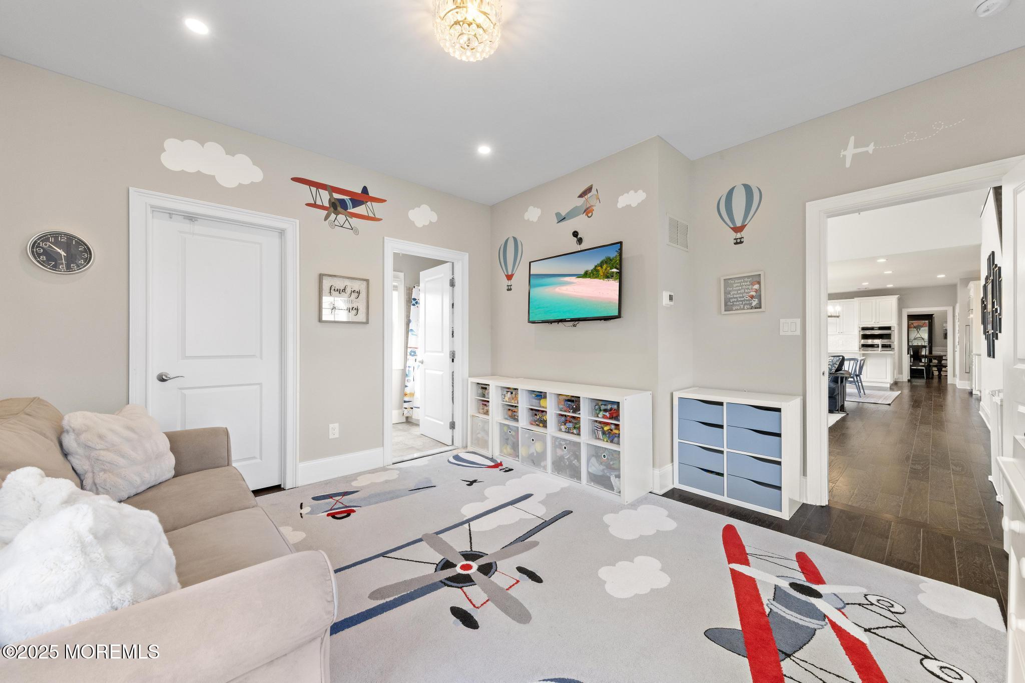 45 Windermere Road Lincroft, NJ 07738 - Photo 18 of 68 a living room with furniture and a flat screen tv