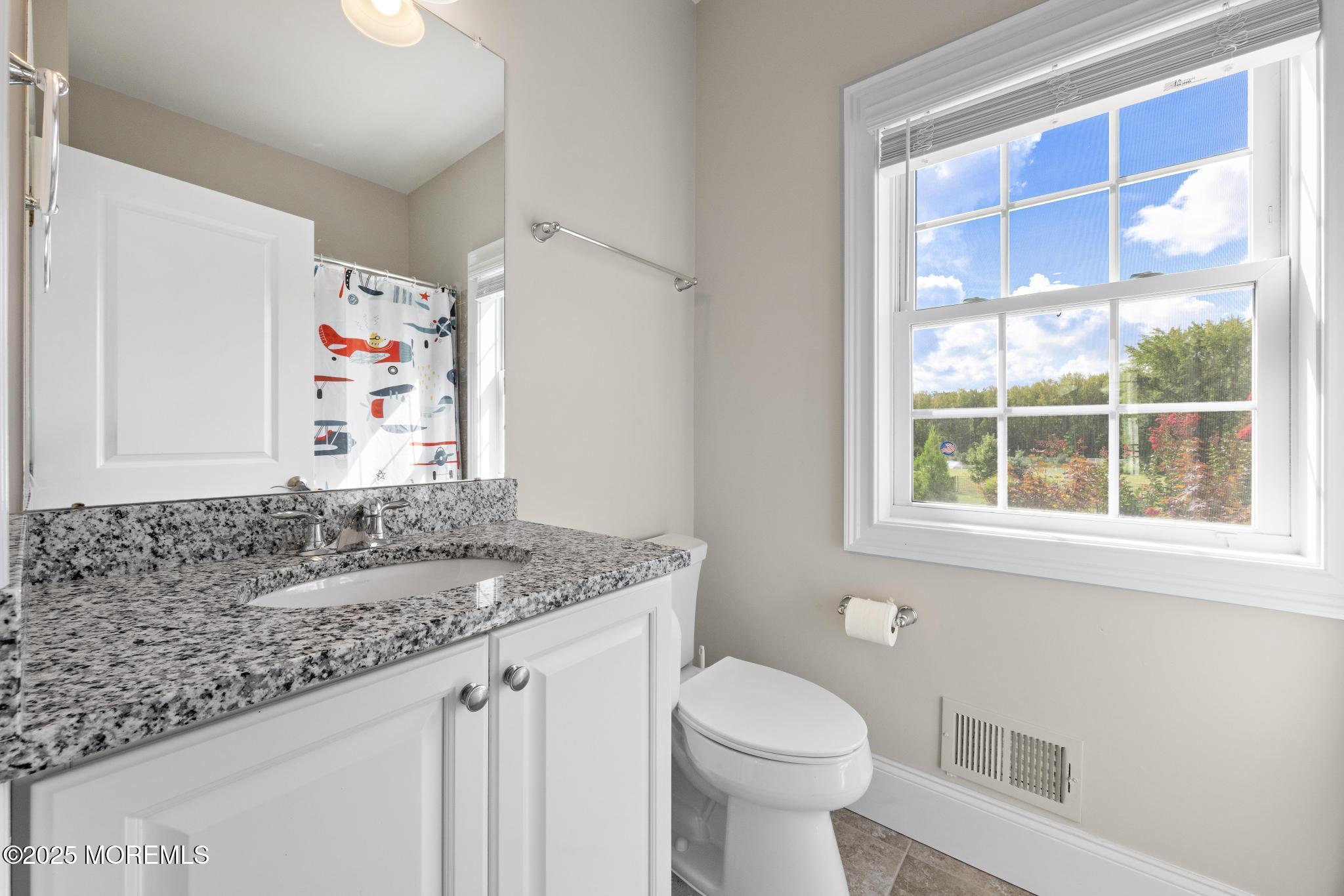 45 Windermere Road Lincroft, NJ 07738 - Photo 20 of 68 a bathroom with a granite countertop sink and a toilet