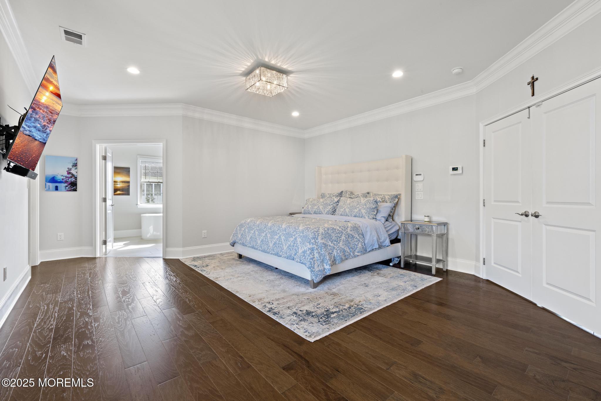 45 Windermere Road Lincroft, NJ 07738 - Photo 30 of 68 a bedroom with a bed and a flat screen tv