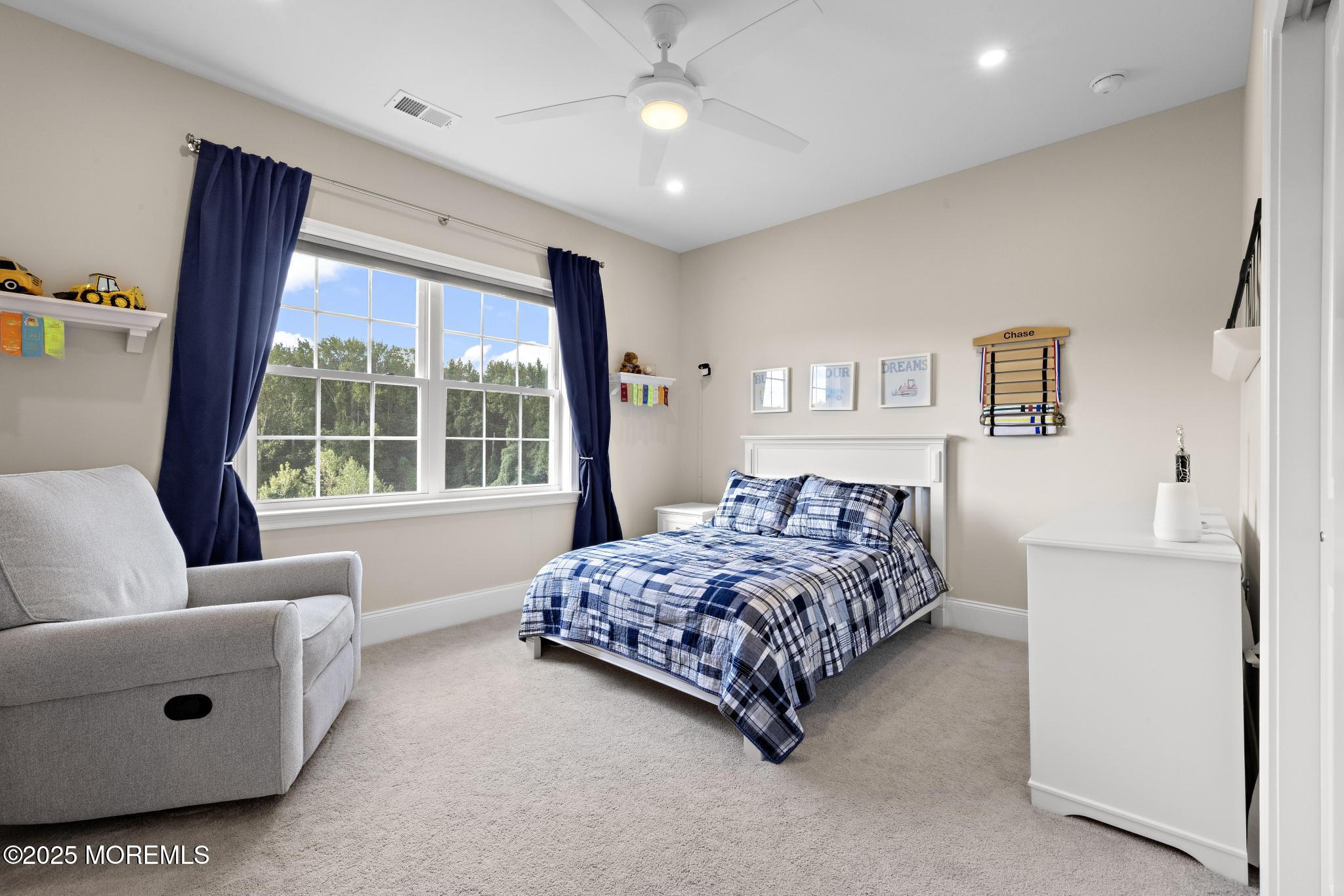 45 Windermere Road Lincroft, NJ 07738 - Photo 36 of 68 a bedroom with a bed wooden floor and window