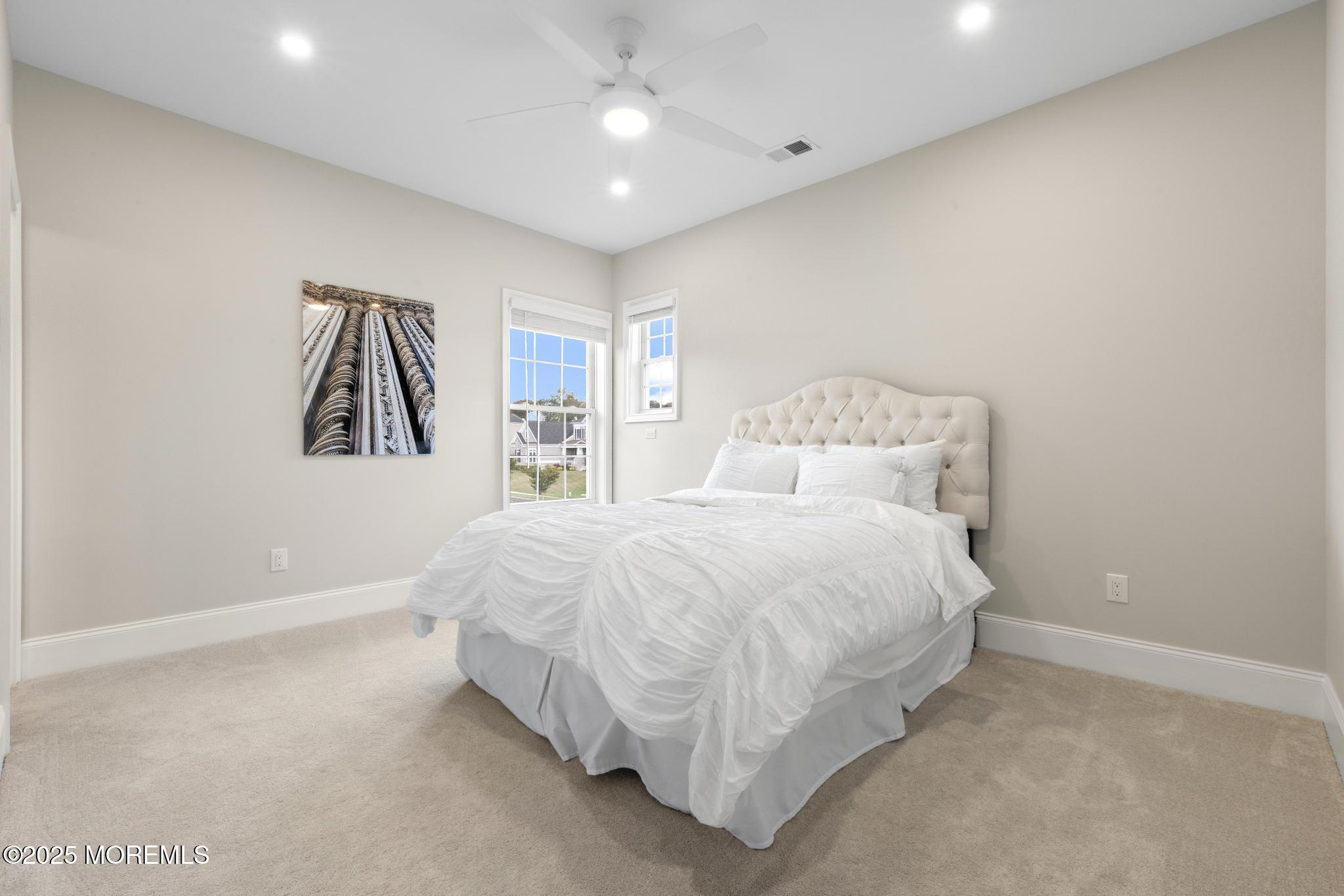 45 Windermere Road Lincroft, NJ 07738 - Photo 42 of 68 a large bed sitting in a room next to a window