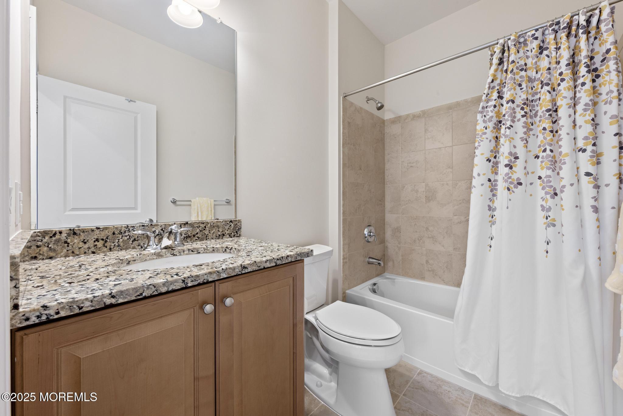 45 Windermere Road Lincroft, NJ 07738 - Photo 43 of 68 a bathroom with a granite countertop sink and a mirror