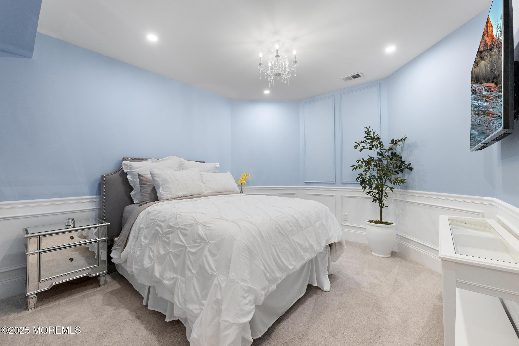 45 Windermere Road Lincroft, NJ 07738 - Photo 44 of 68 a bedroom with a bed and a potted plant